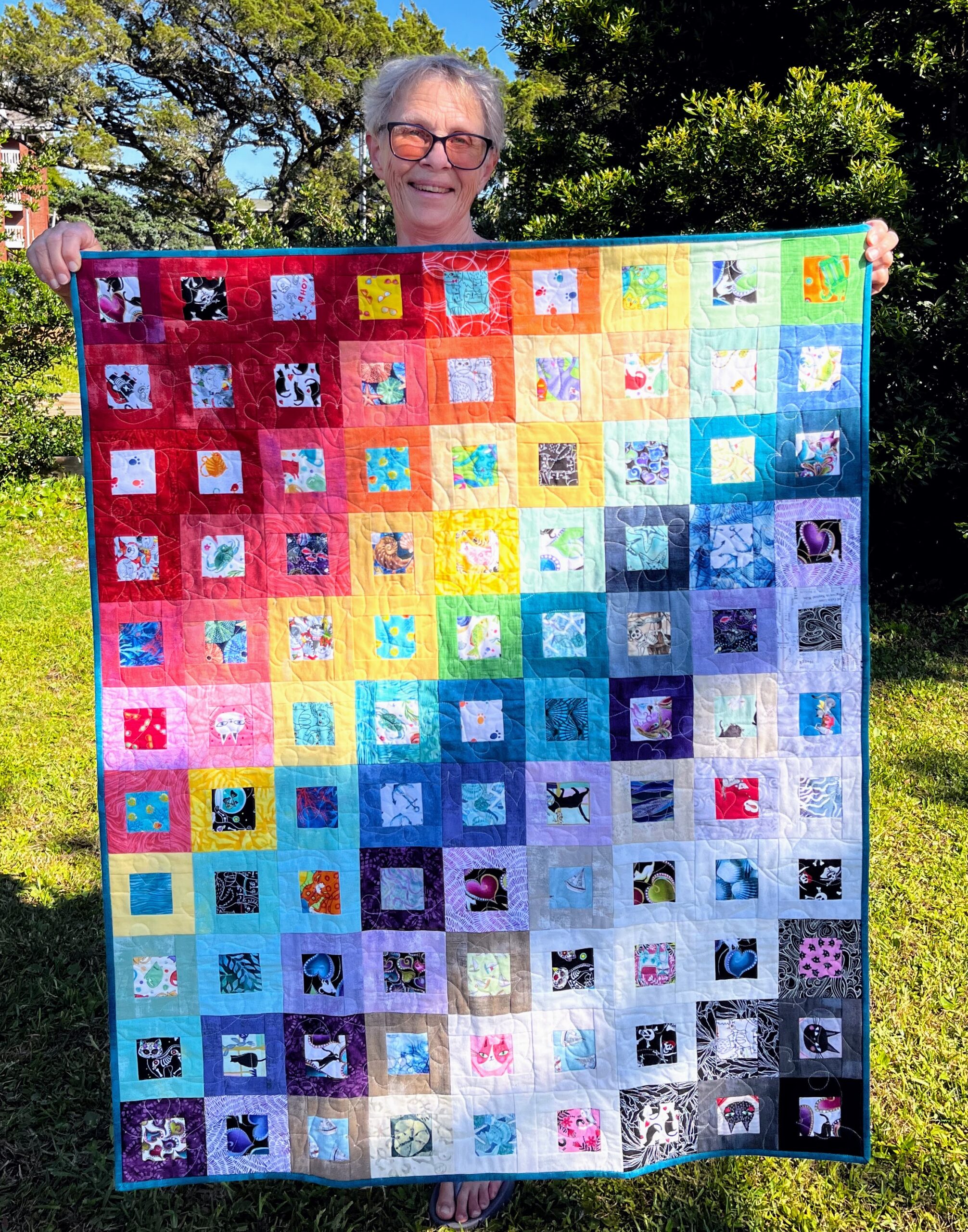 Elaine Spray of Taos, New Mexico, was the lucky winner of the smaller of the quilts made and donated by Nora Blythe. Congratulations!
